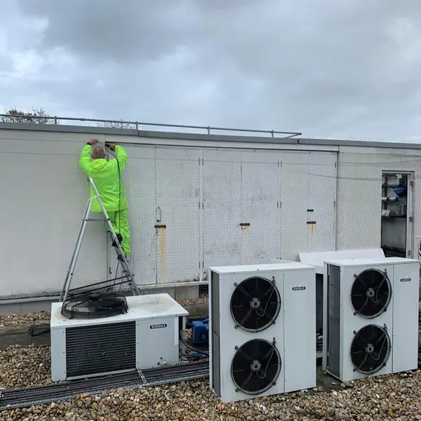 Technician at work on a commercial rooftop